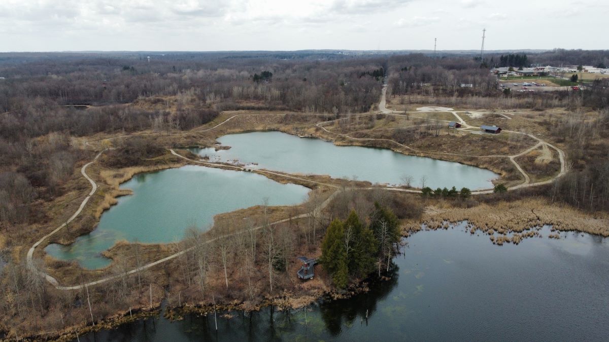 Drone shot of Blue Heron Preserve in Burton Ohio shows the lake and wetlands of this 116 acre property.