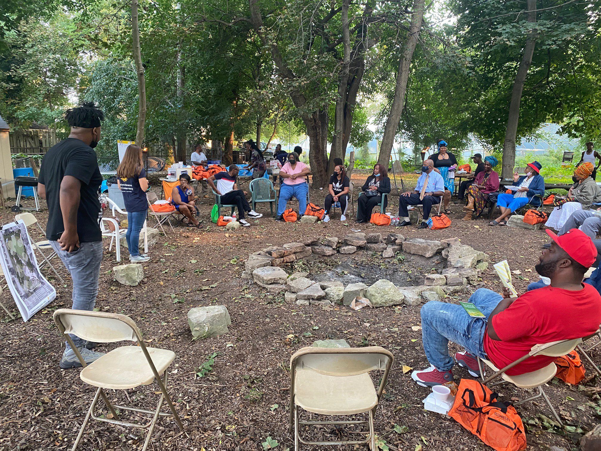 Hough neighborhood residents gather around a firepit to create plans for a new public greenspace in Cleveland